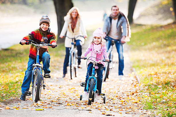 istock Happy family riding bicycles in nature 185251163