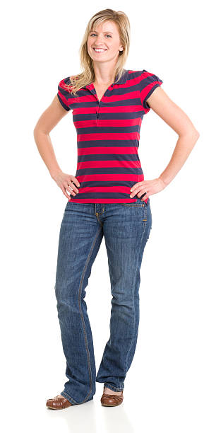istock Smiling Young Woman Standing With Hands On Hips 185251418