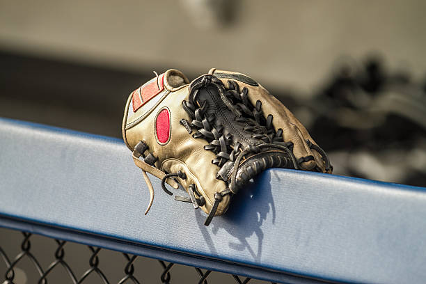 istock Leather Baseball Glove Mitt on Fence, Stitched Brown Color 185251530