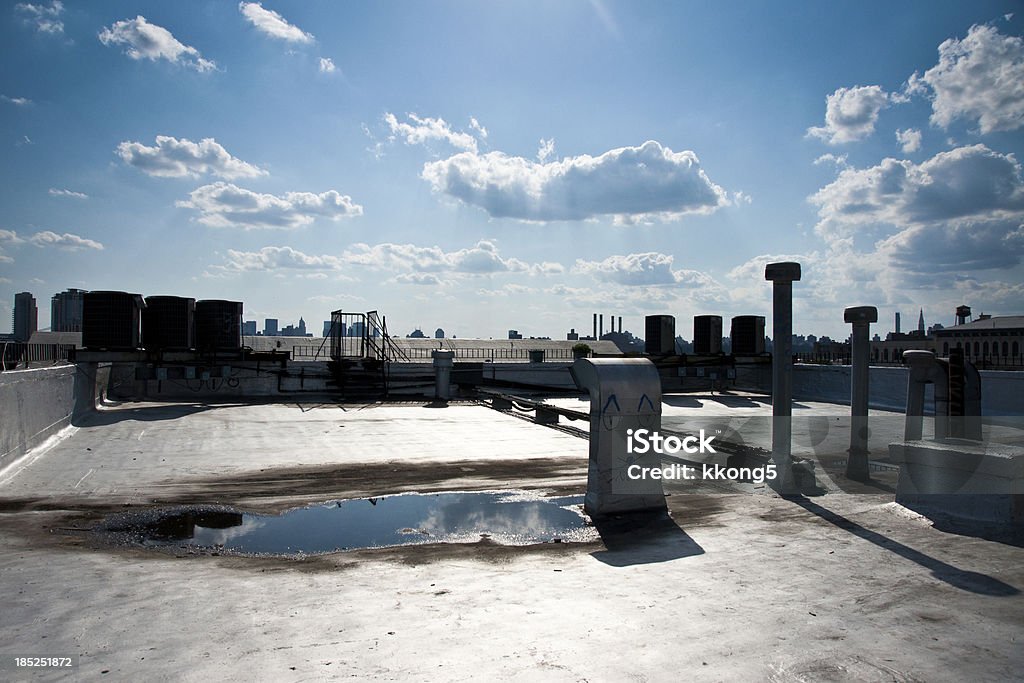 Brooklyn Rooftop with Manhattan Skyline as Background Brooklyn Rooftop with Manhattan Skyline as Background in sunny afternoon Rooftop Stock Photo