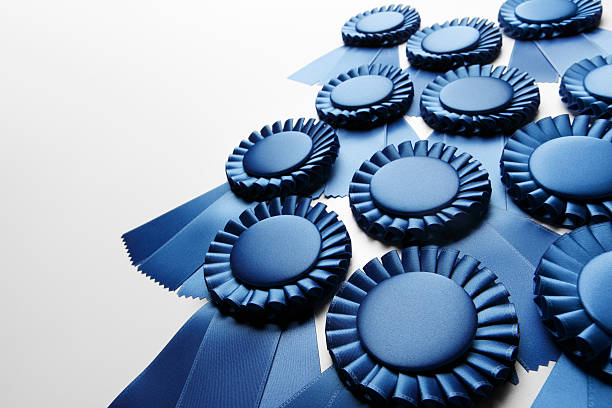 Blue Ribbons An array of blue ribbons. Shot with shallow depth of field. award ribbon photos stock pictures, royalty-free photos & images