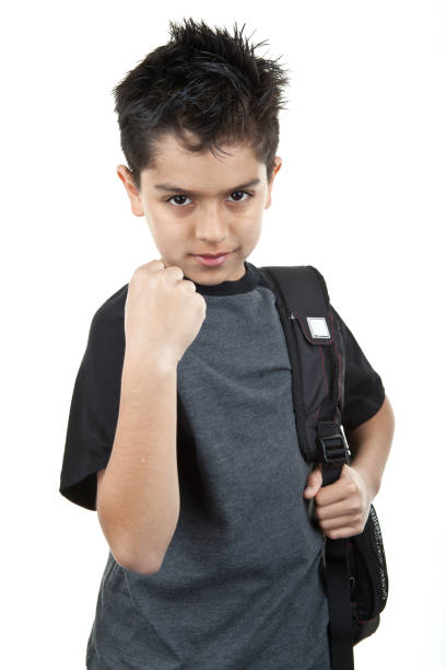 istock angry bully with fist and backpack 185252161