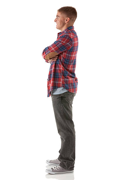 istock Happy man standing with his arms crossed 185252407