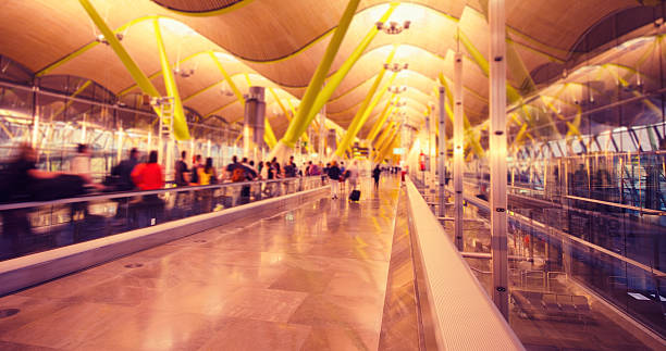 istock Commuter running on contemporary glass airport 185252419