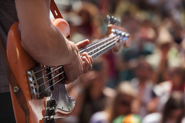 istock bass player infront of crowd at outdoor performance 185252479