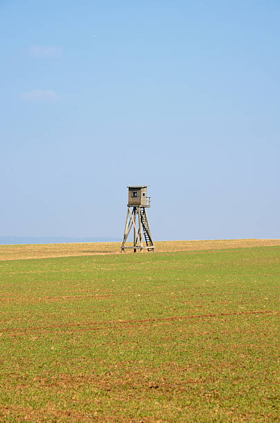 istock Hunting stand in field under clear sky 185252608