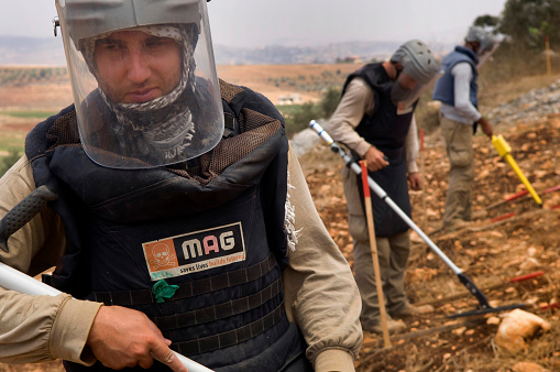Tyre, Lebanon. July 15th 2010 \nA team from The Mines Advisory Group (MAG) clearing unexploded cluster munitions in the farmland of southern Lebanon.