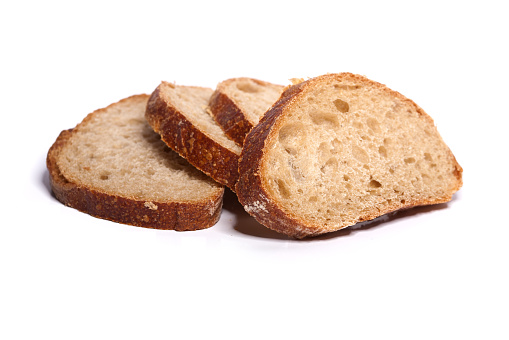 Loafs of bread on white background