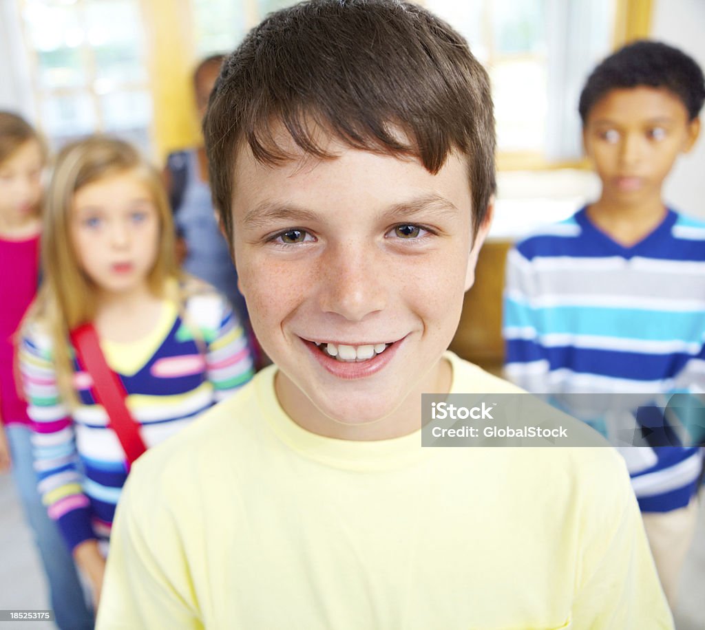 I'm not nervous for the first day of school! Smiling little schoolboy in the classroom - portrait 10-11 Years Stock Photo