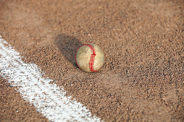 istock Worn Baseball inside or outside Foul Line 185253441