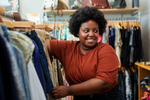 istock African American woman browsing for secondhand clothes inside thrift shop 1852535230