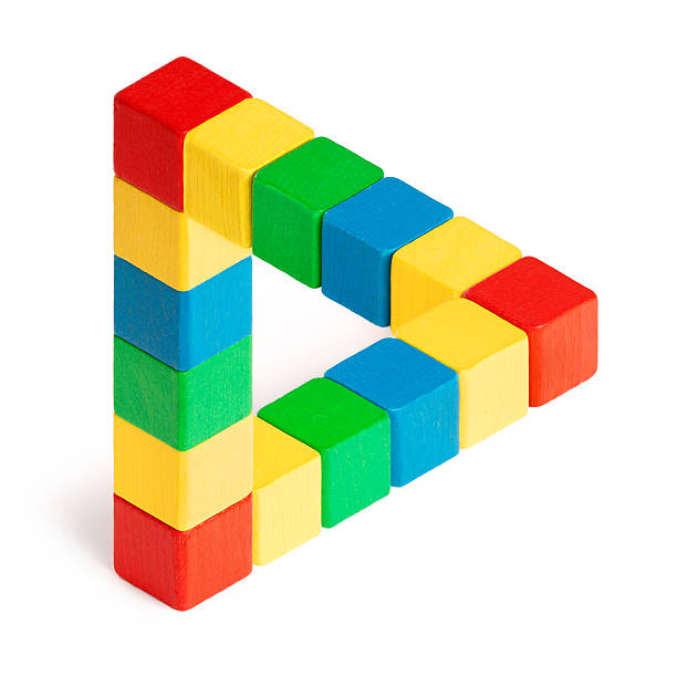 Penrose Triangle Impossible three dimensional triangle made by wood colored blocks on white background. esher stock pictures, royalty-free photos & images