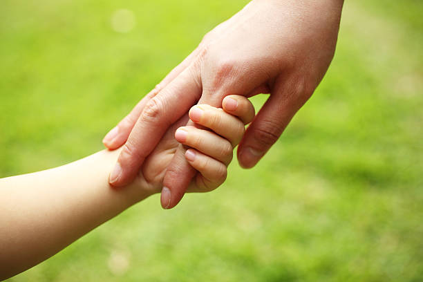 istock Mother and Child Holding Hands 185253718
