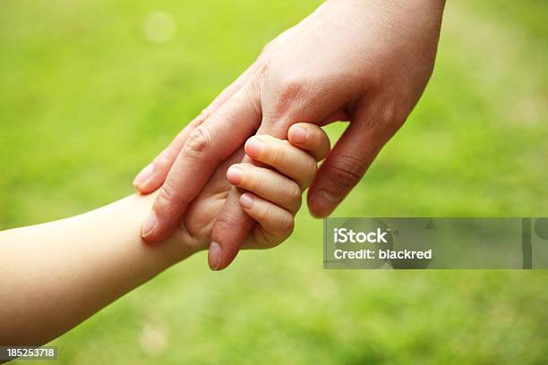 Mother And Child Holding Hands Stock Photo - Download Image Now - Reaching, A Helping Hand, Agricultural Field