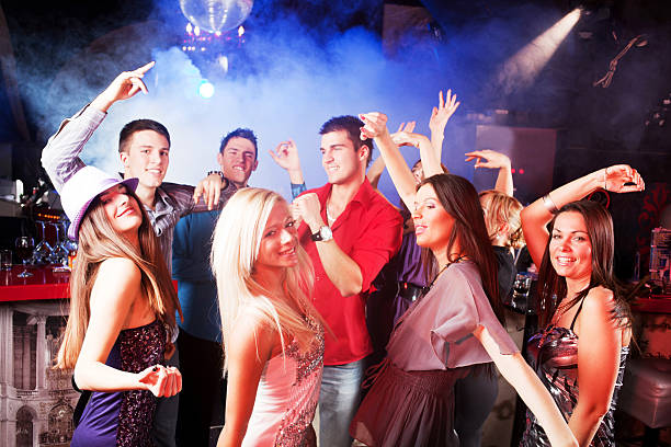istock Group of young people dancing at the discotheque. 185253992