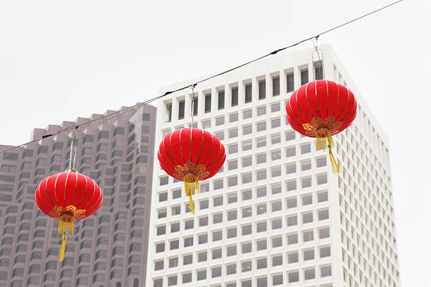 istock three red chinese lanterns against San Francisco skyscraper building 185254179