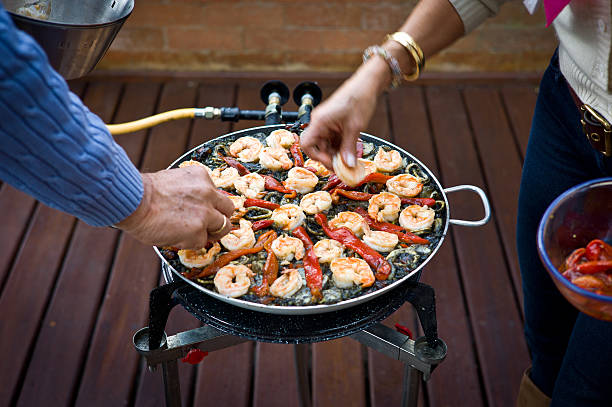 Married Couple Making a Black Paella Together RELEVANT LIGHT BOXES: COOKING