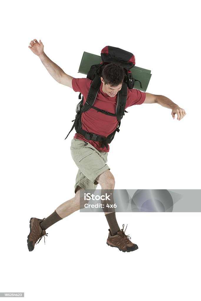 Male hiker jumping Male hiker jumpinghttp://www.twodozendesign.info/i/1.png Hiking Stock Photo