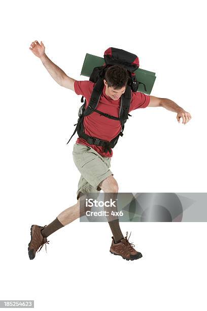 Male Hiker Jumping Stock Photo - Download Image Now - Hiking, Arms Outstretched, Full Length