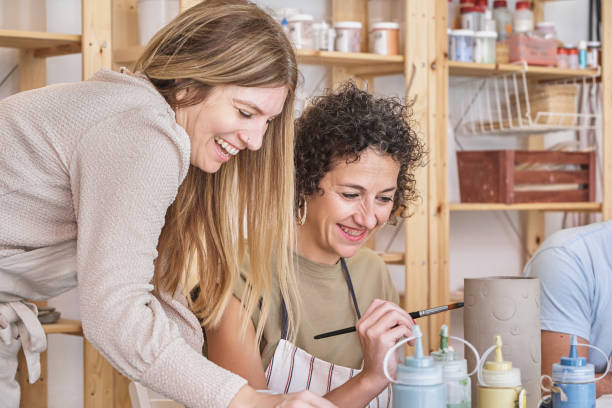 istock Joyful women painting ceramics in a workshop 1852547486