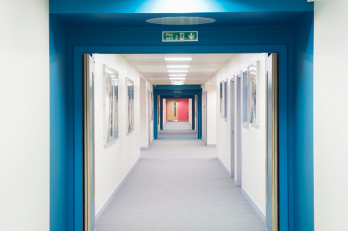 Looking along a corridor of a modern secondary school.