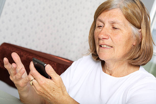 istock Mature Woman using Cellphone 185254927