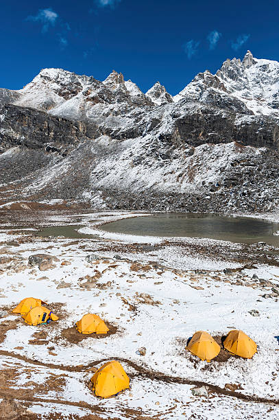 istock Base camp tents snowy mountain peaks Himalayas 185254959