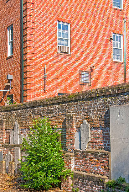 istock Grave stones against cemetery wall in Georgia 185255822
