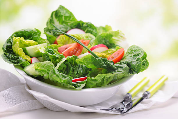 Salad dressed with tomato, cucumber, onion and radish. Prepared to eat.