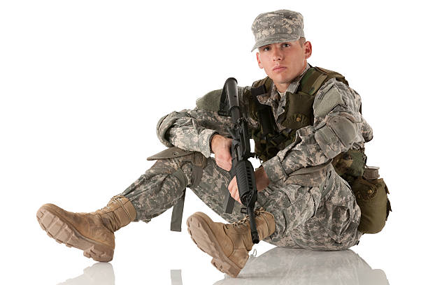 istock Army man sitting on the floor with a rifle 185256059