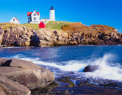 Nubble Lighthouse stands out on the Maine coastine at Cape Neddick