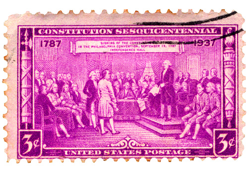 Old postage stamp depicting signing of the US Constitution. George Washington is featured prominently in stamp commemorating the 150th anniversary of the United States Constitution.