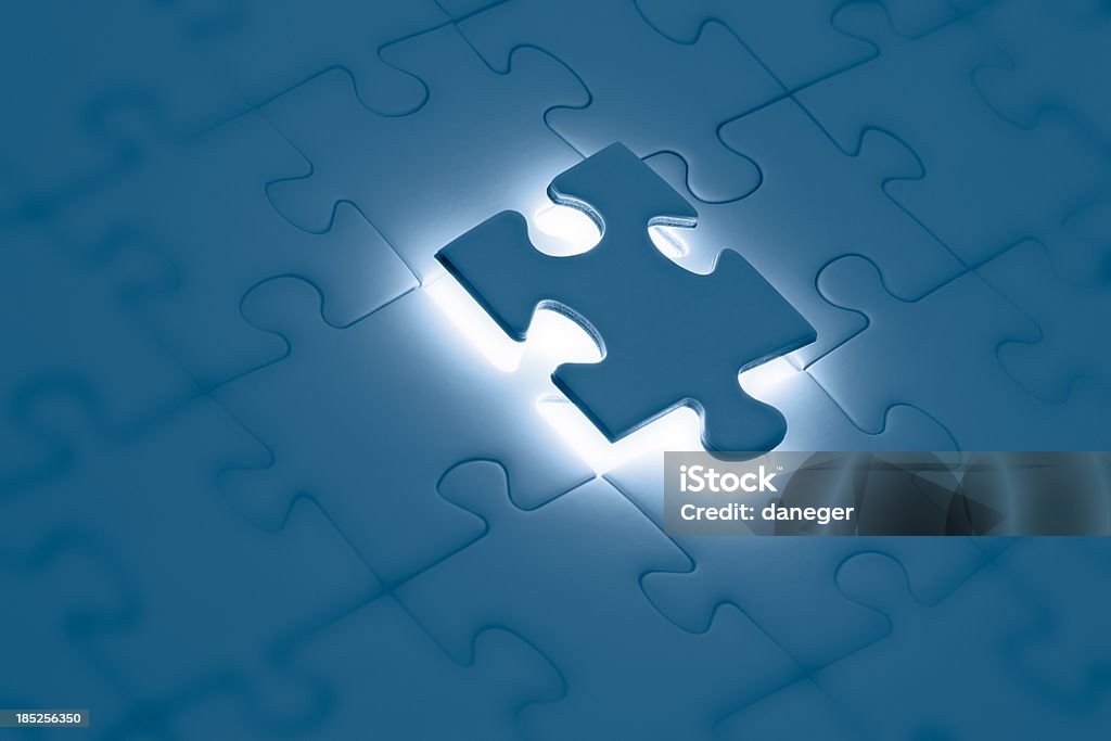 Solution Final piece put into a puzzle. Solution concept. Blue Stock Photo