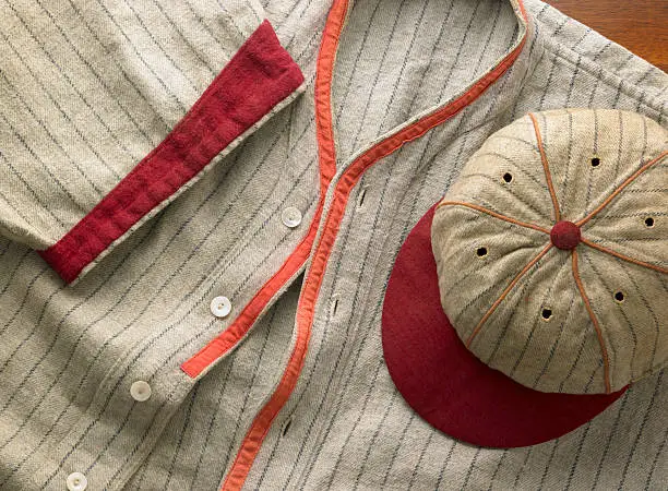 An antique pin-striped wool baseball uniform from the 20's with a matching cap.