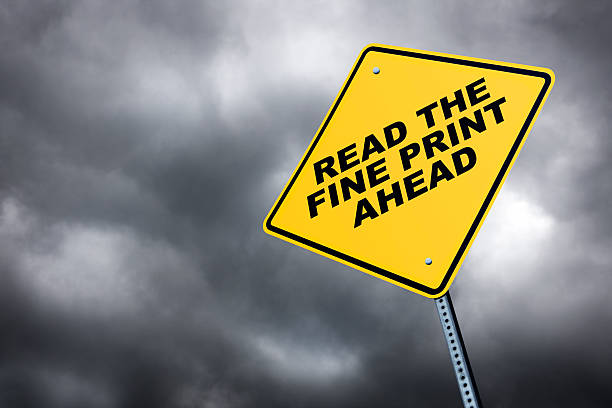 Read The Fine Print Ahead A road sign warning one to read the fine print. read the fine print stock pictures, royalty-free photos & images