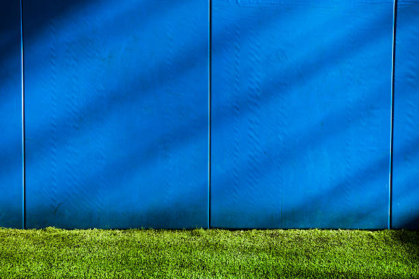 Baseball warning track at the stadium Baseball home run fence in the ballpark outfield outfield stock pictures, royalty-free photos & images