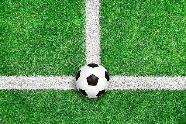 istock Soccer ball on green grass 185256589