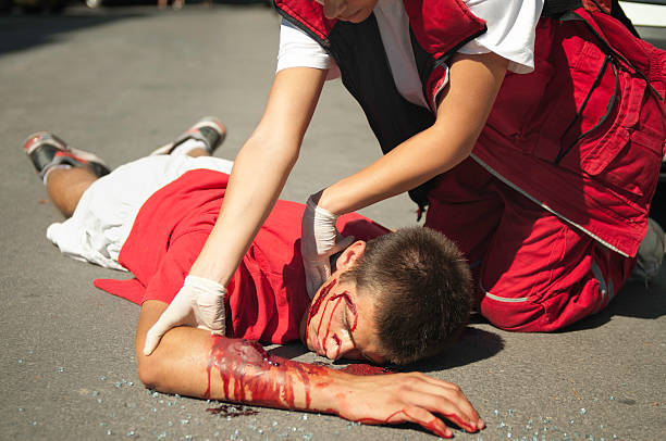 istock Paramedic helping injured boy 185256621