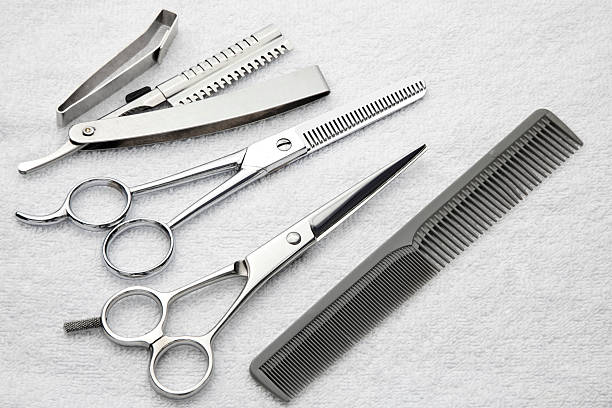 istock Hair cutting  tools, shears, razor, comb on a terry towel 185256799