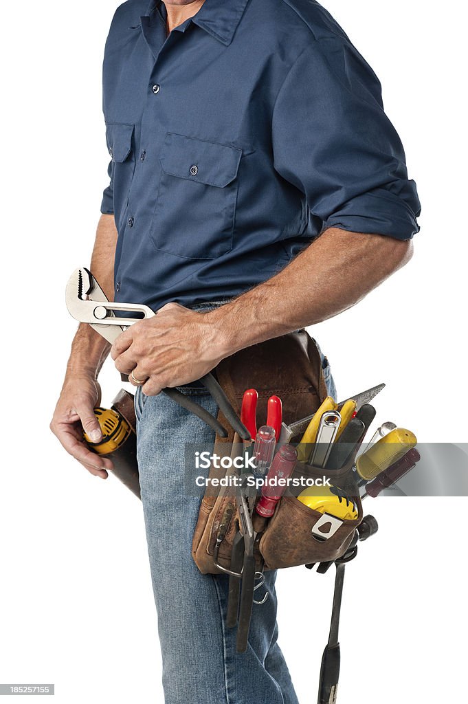 Handyman With Tool Belt Male handyman with tool belt against white background holding channel wrench.Take a look at our lightbox's of other related images. Craftsperson Stock Photo