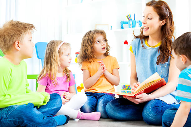 istock Teacher Telling A Story to children. 185257754