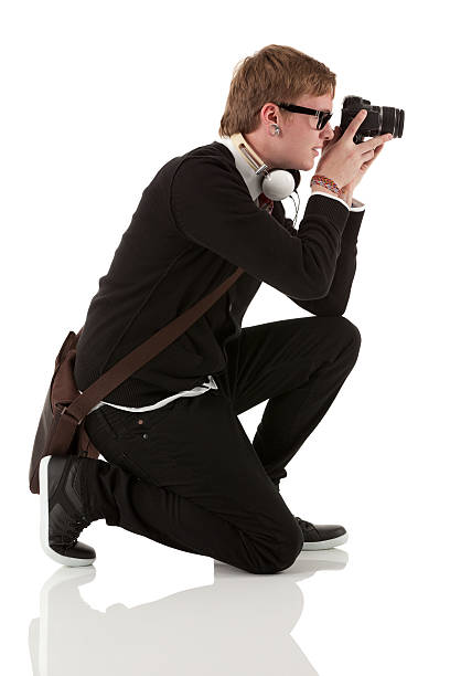 Profile of man photographing with a camera