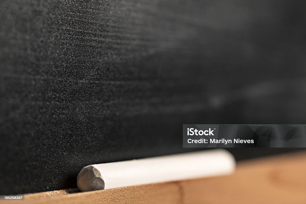 chalk resting on board closeup of chalk on a blackboard. Back to School Stock Photo