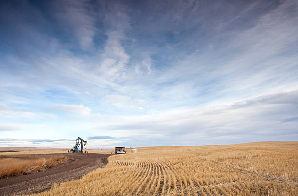 прерия pumpjack - alberta prairie autumn field стоковые фото и изображения