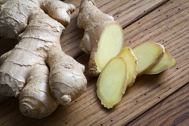 Ginger Root of ginger on wooden table ginger stock pictures, royalty-free photos & images