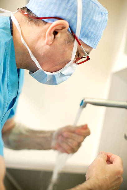 Doctor washing hands stock photo