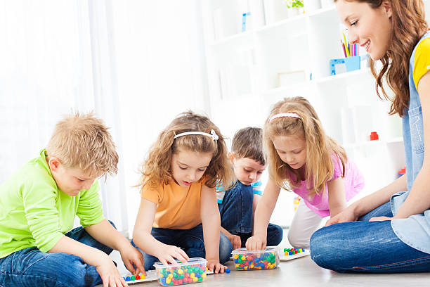 istock Preschool: Children Having Activities with mosaic toy 185259470