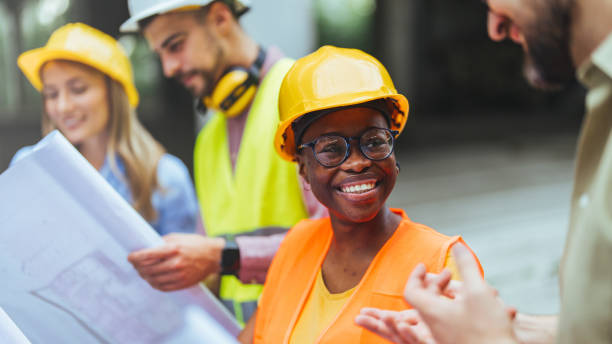istock Engineers wearing safety hardhat having work conversation on the safety of the structure. 1852601255
