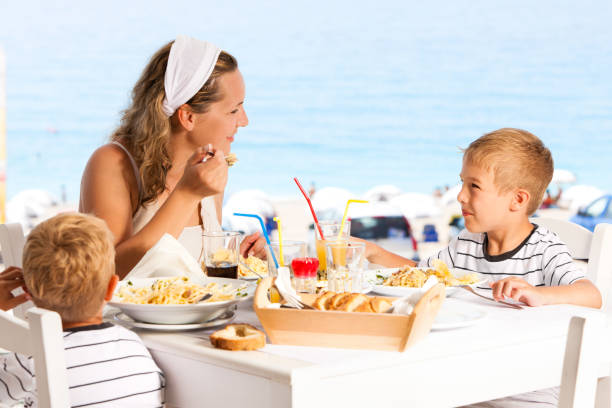 istock Family having lunch in the restaurant 185260235