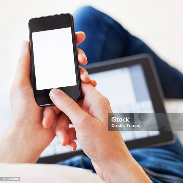 Woman Using Smartphone And Digital Tablet Stock Photo - Download Image Now - Addict, Addiction, Adult